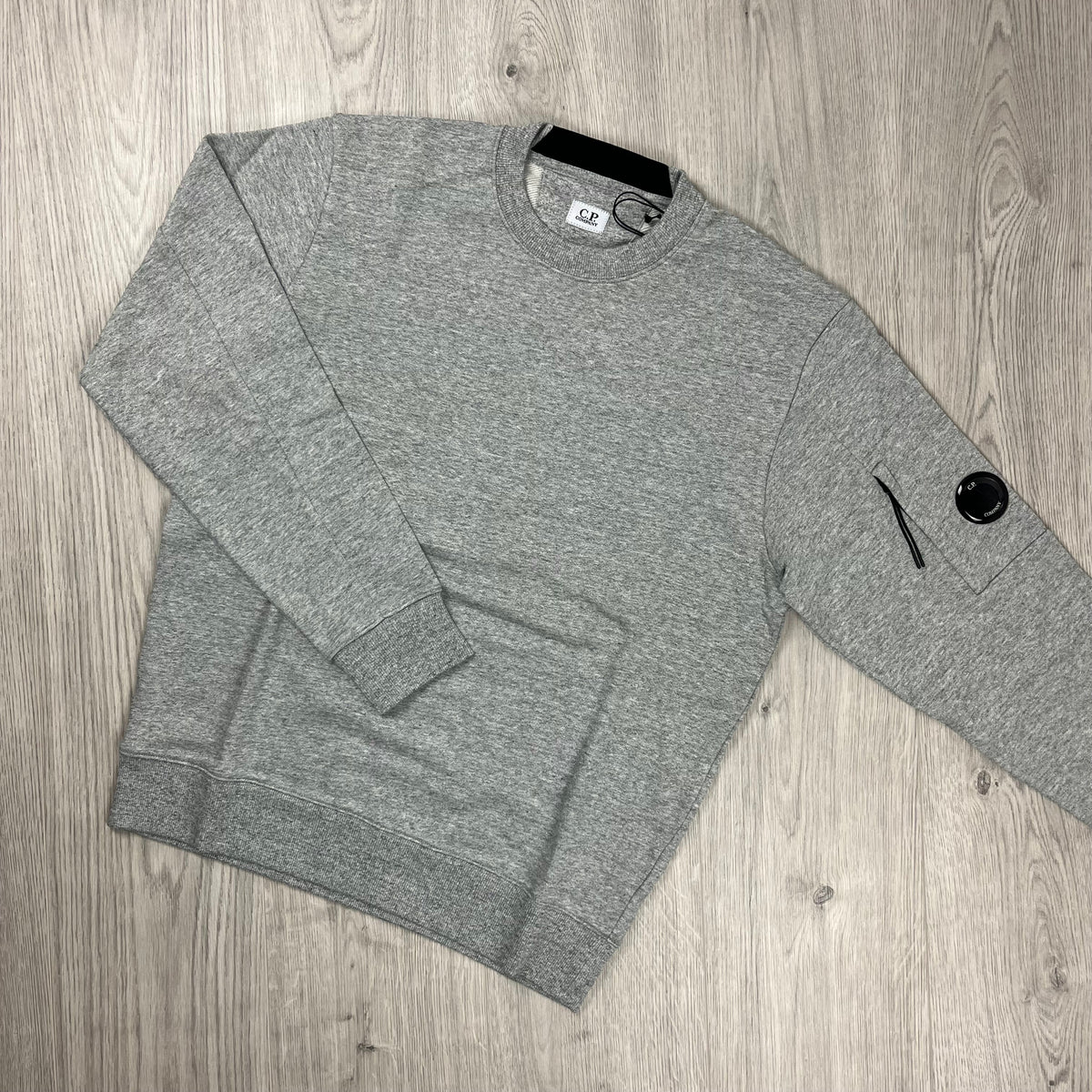 CP Company tracksuit in Greystone Melange. On sale at Open Attire.