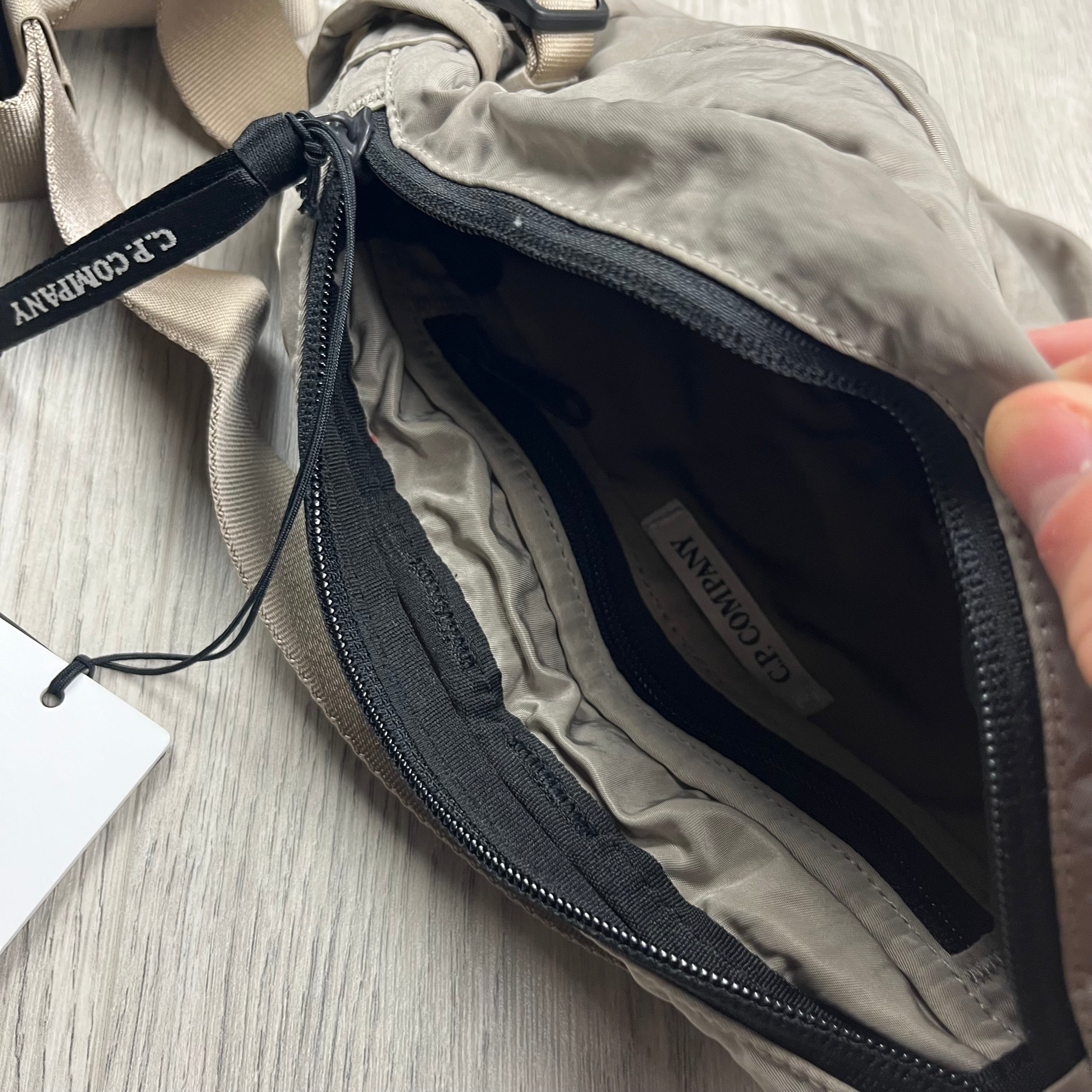 CP Company Nylon B Crossbody Bag in Vintage Khaki. On sale at Open Attire.