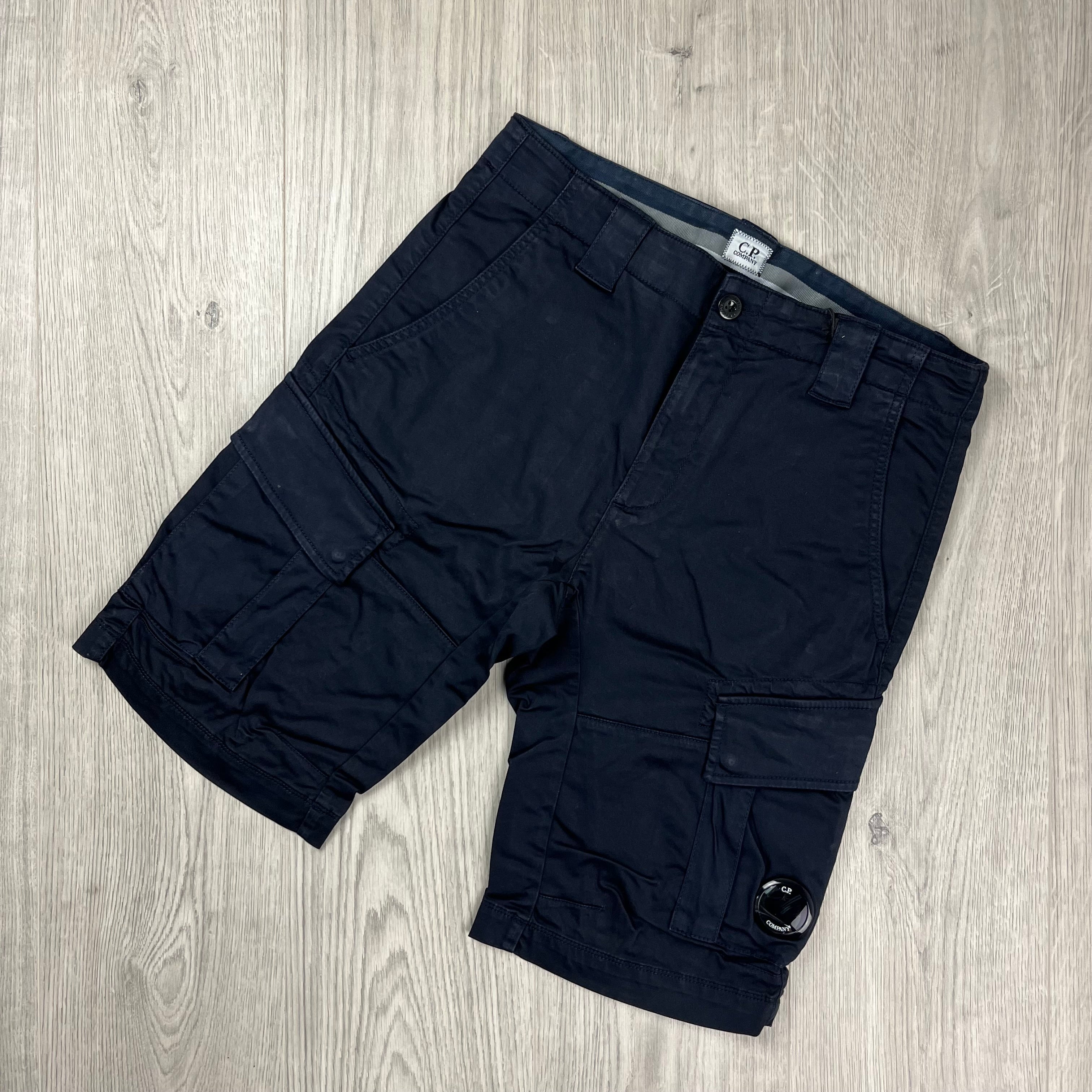 CP Company Stretch Sateen Cargo Shorts in Total Eclipse. On sale at Open Attire.