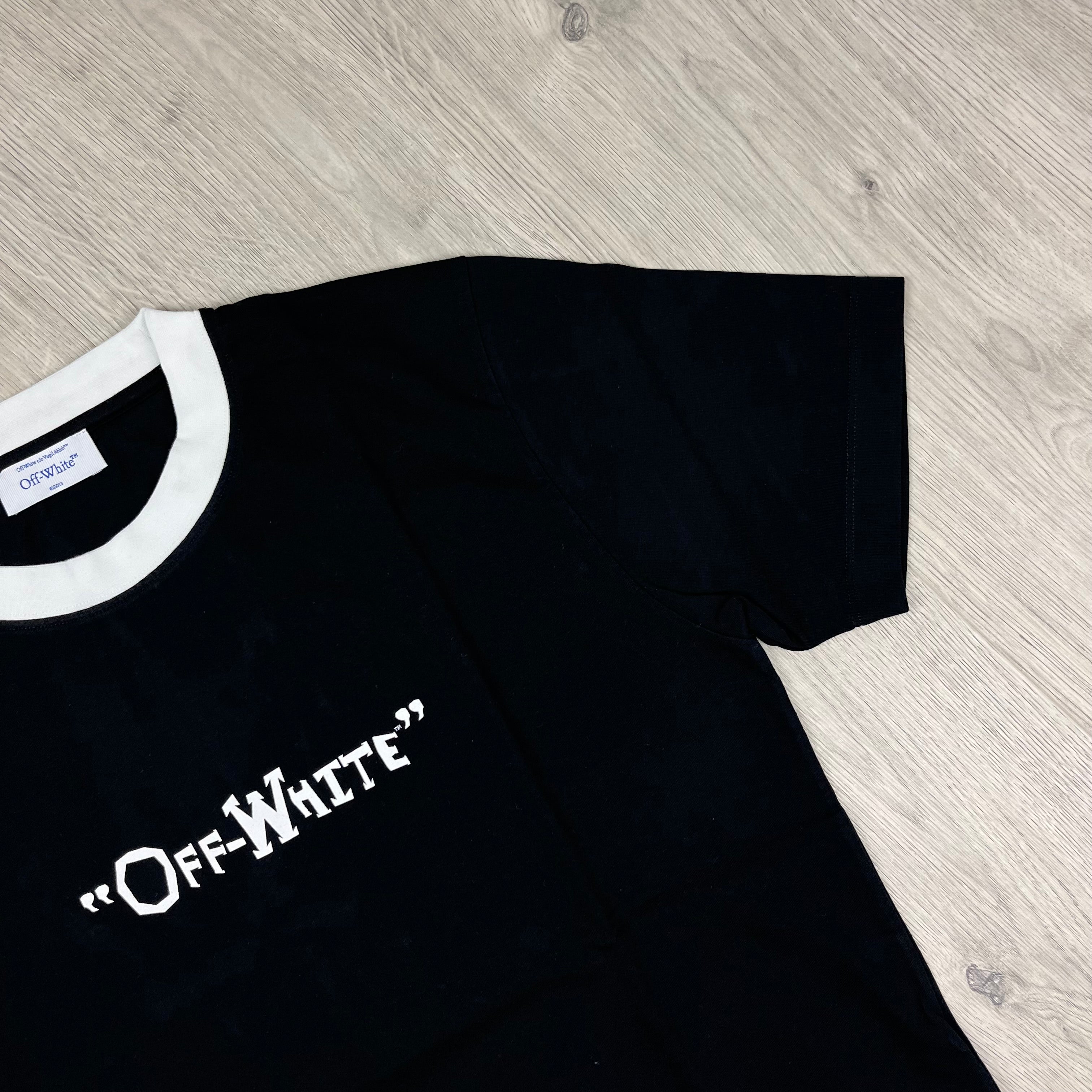 Off-White c/o Virgil Abloh Quote T-Shirt in Black. On sale at Open Attire.