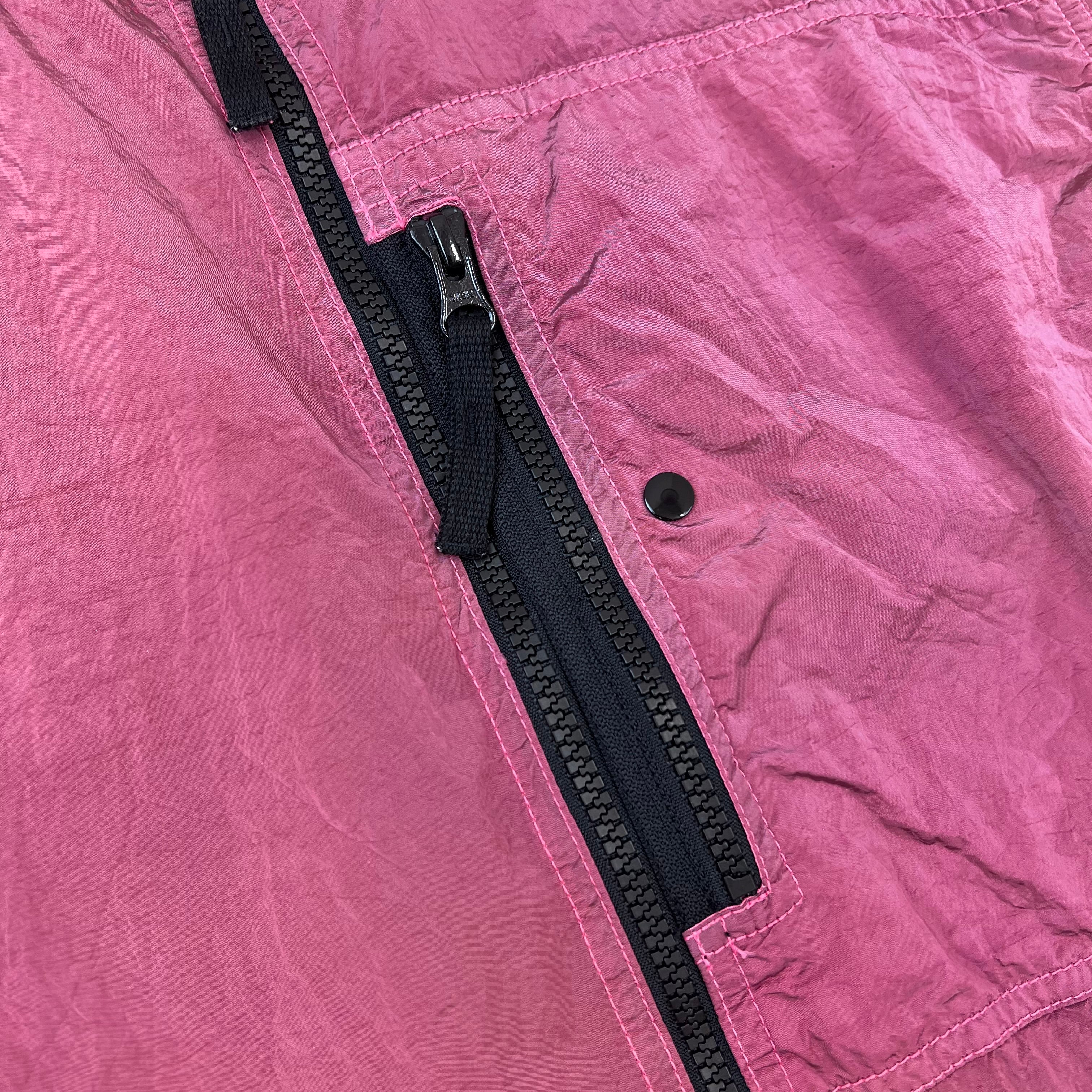 A close view of the zip chest pocket on a Stone Island Nylon Metal Overshirt in Geranium.