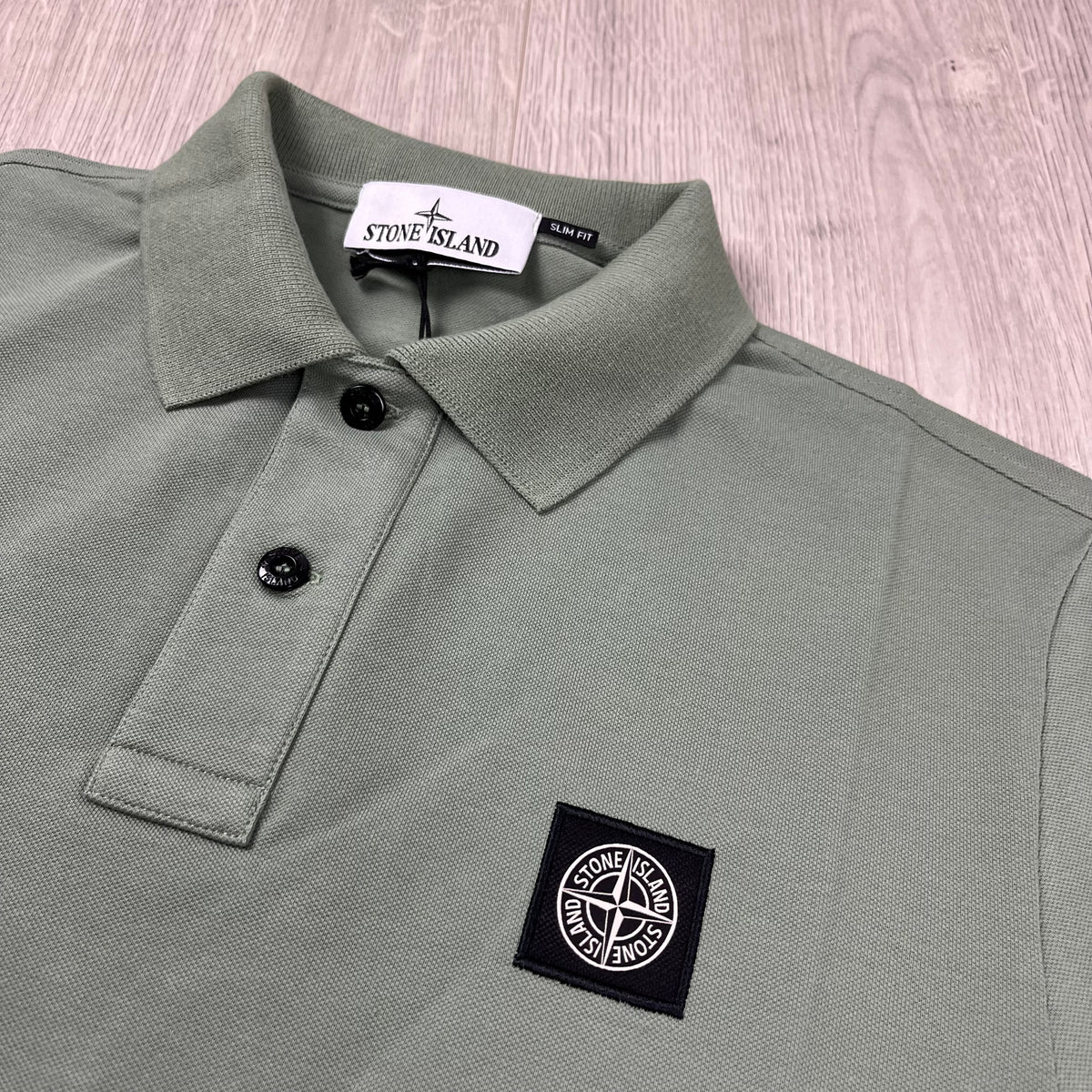 Stone Island Piqué Patch Polo Shirt in Sage Green. On sale at Open Attire.