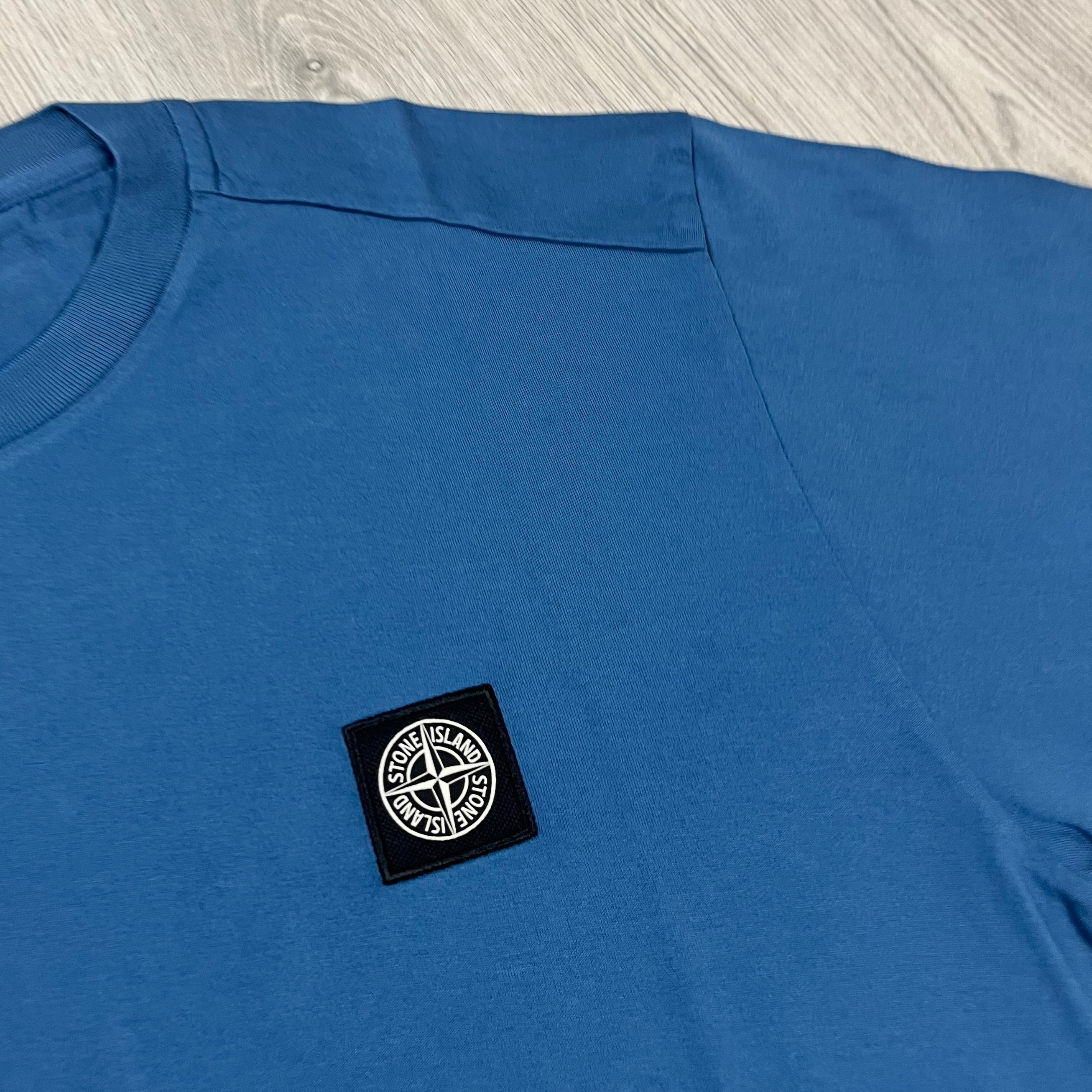 Stone Island Patch T-shirt in Avio Blue. On sale at Open Attire.