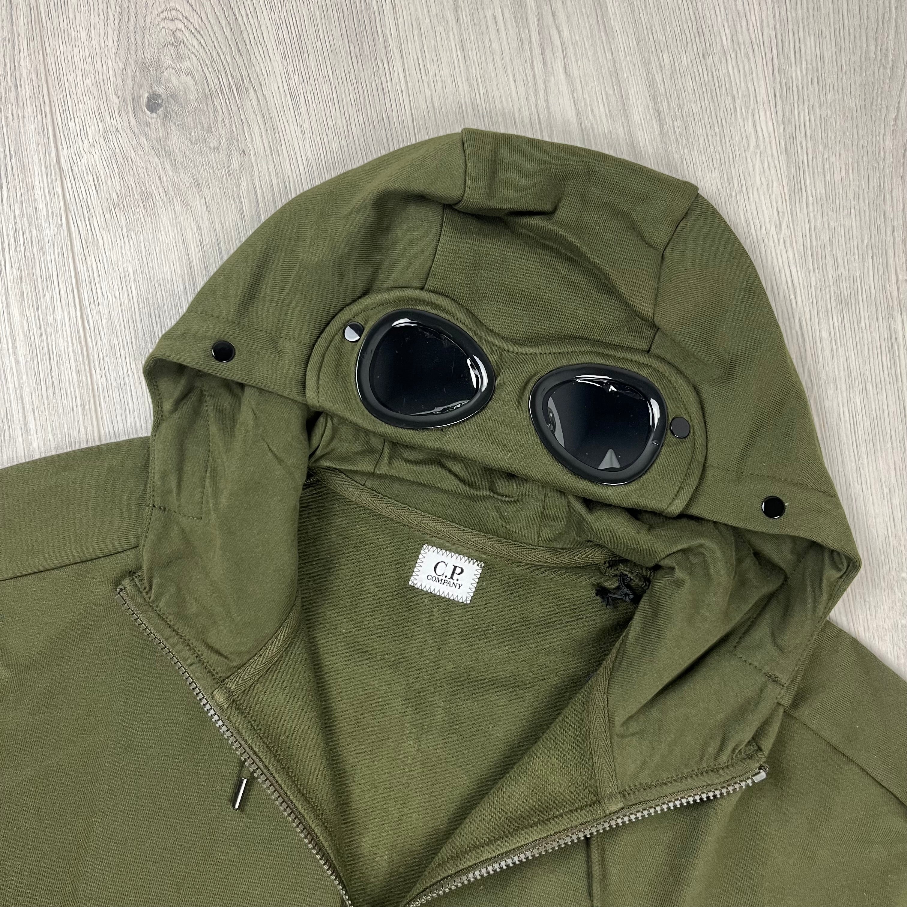 CP Company Raised Fleece Goggle Hoodie in Ivy Green. On sale at Open Attire. 