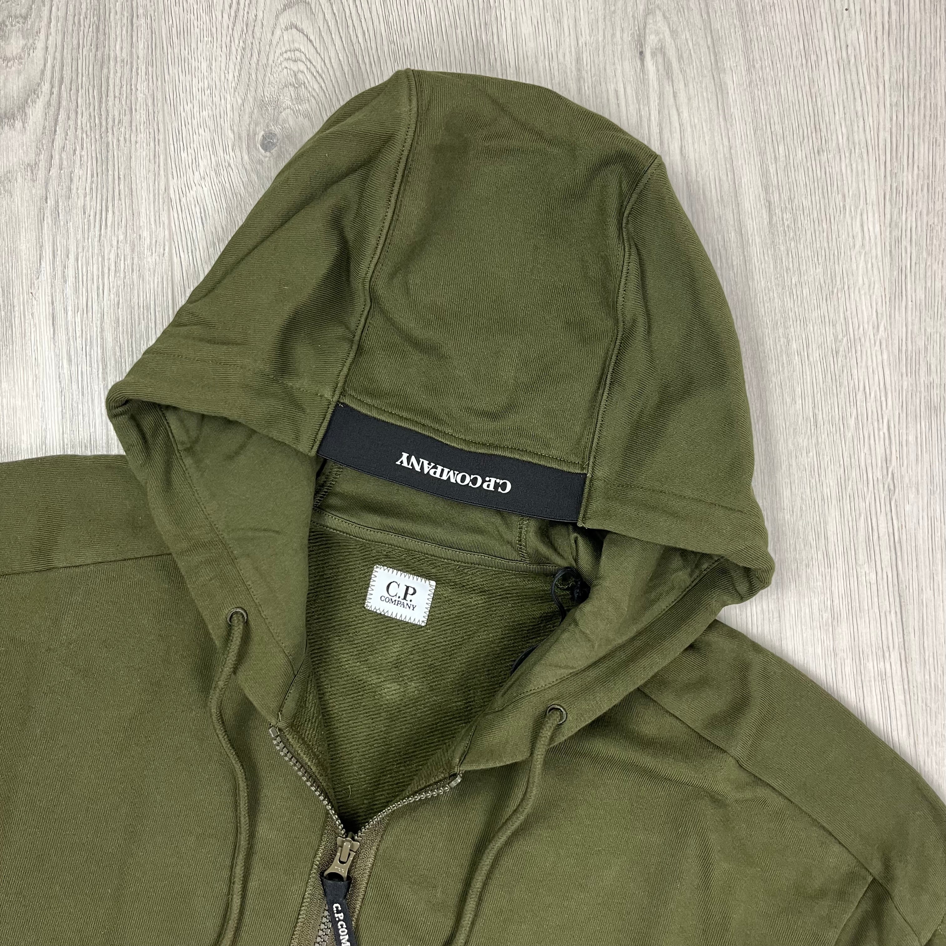 CP Company Diagonal Raised Fleece Zipped Hooded Sweatshirt in Ivy Green. On Sale at Open Attire.