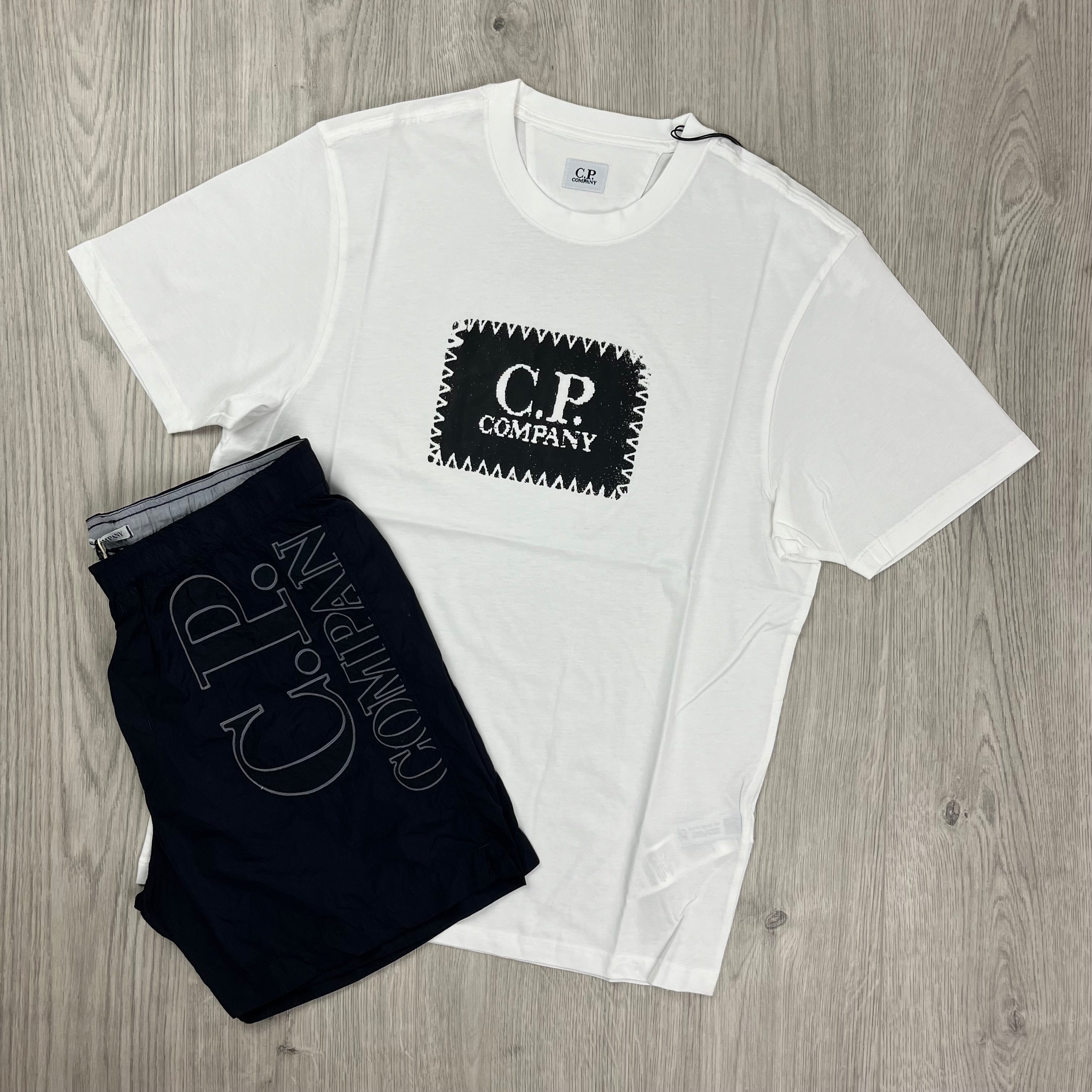 CP Company Holiday Set consisting of a Gauze White T-shirt and Total Eclipse swimshorts. On sale at Open Attire.