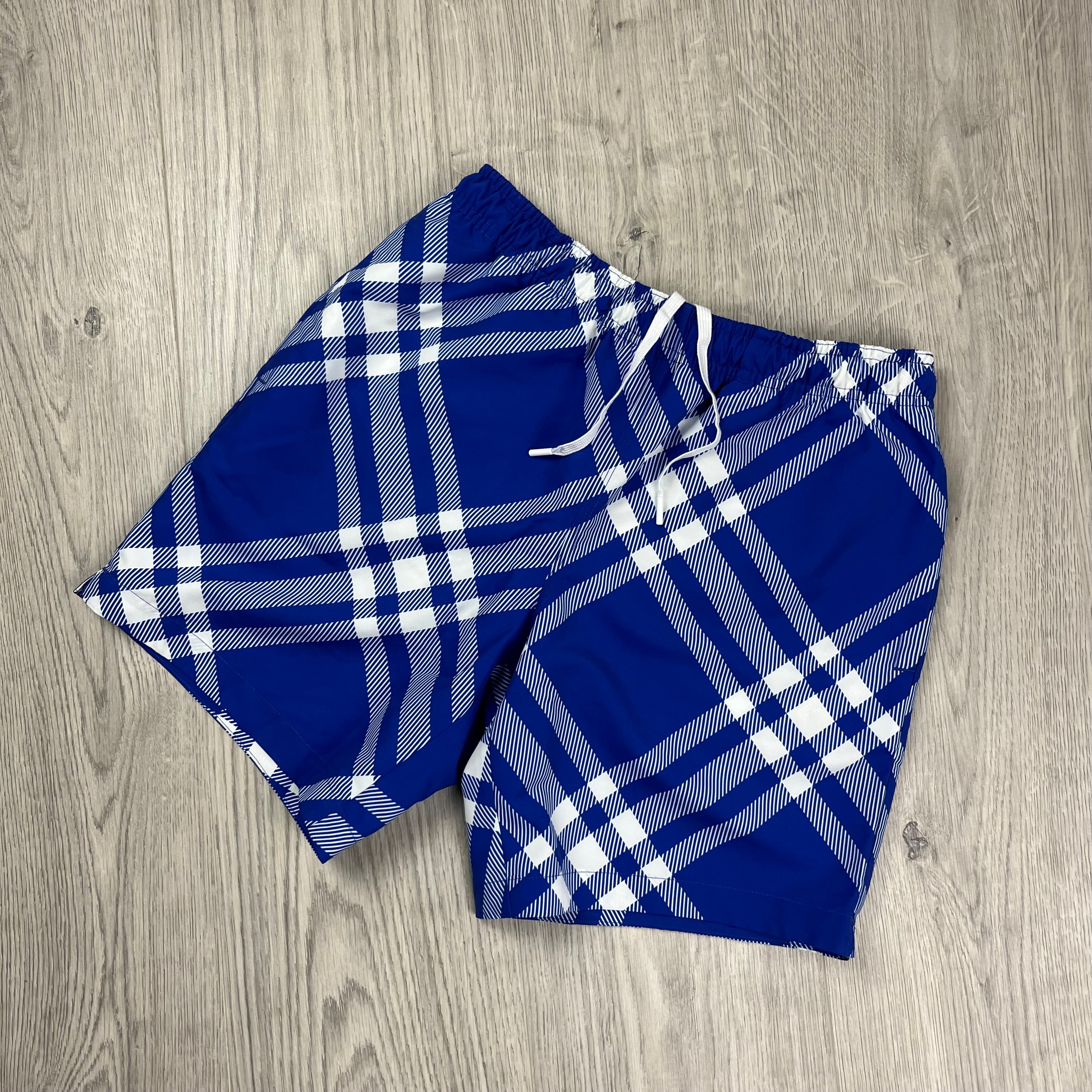 Burberry Check Swim Shorts in Blue. On sale at Open Attire.