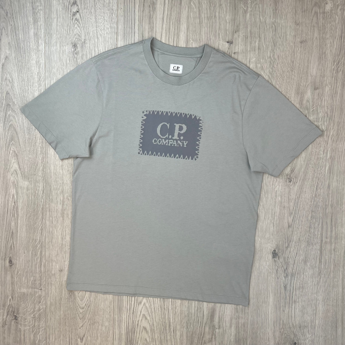 Front view of a CP Company 30/1 Stamp T-Shirt in Flint Grey.
