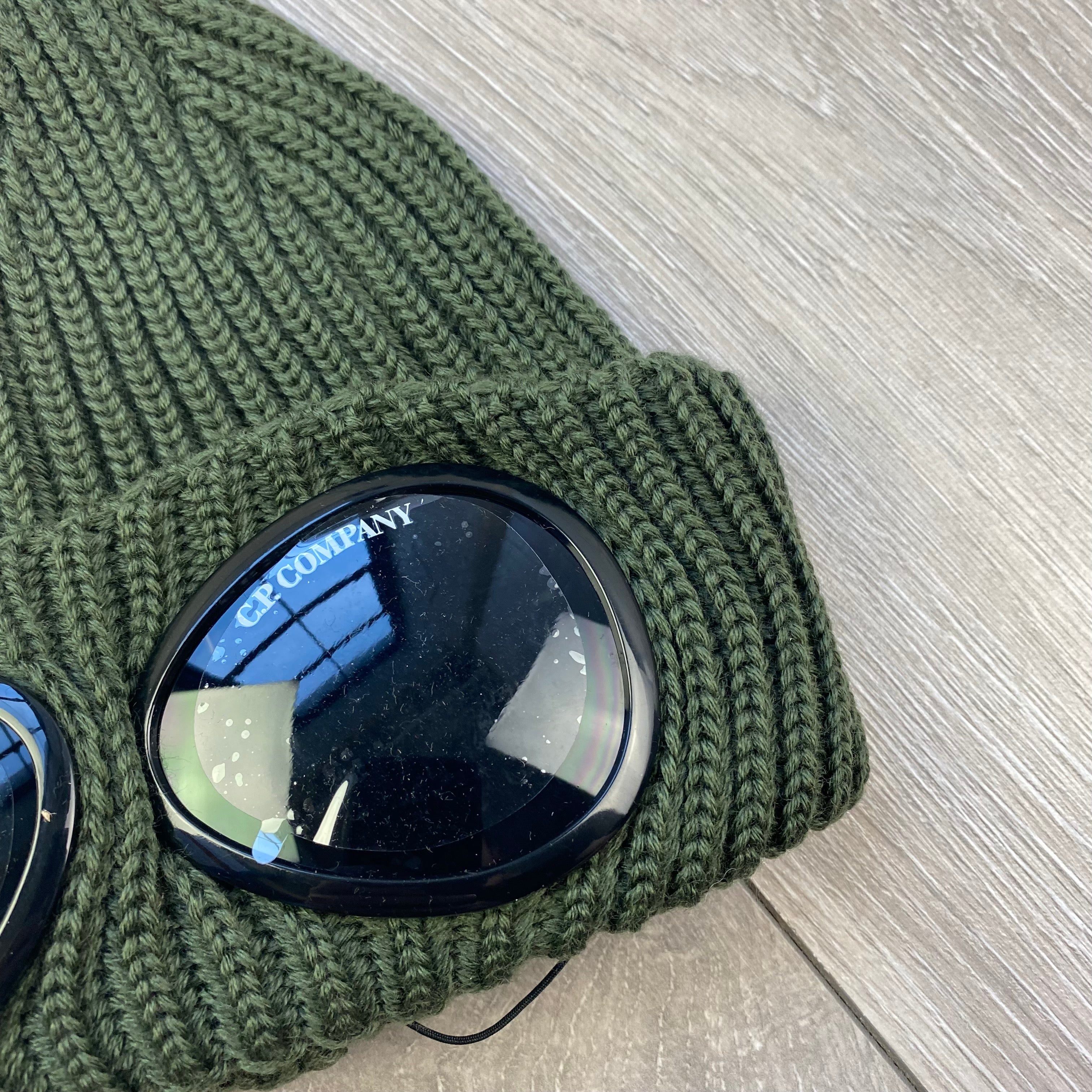 CP Company Extra Fine Merino Wool Goggle Beanie in Ivy Green. On sale at Open Attire.