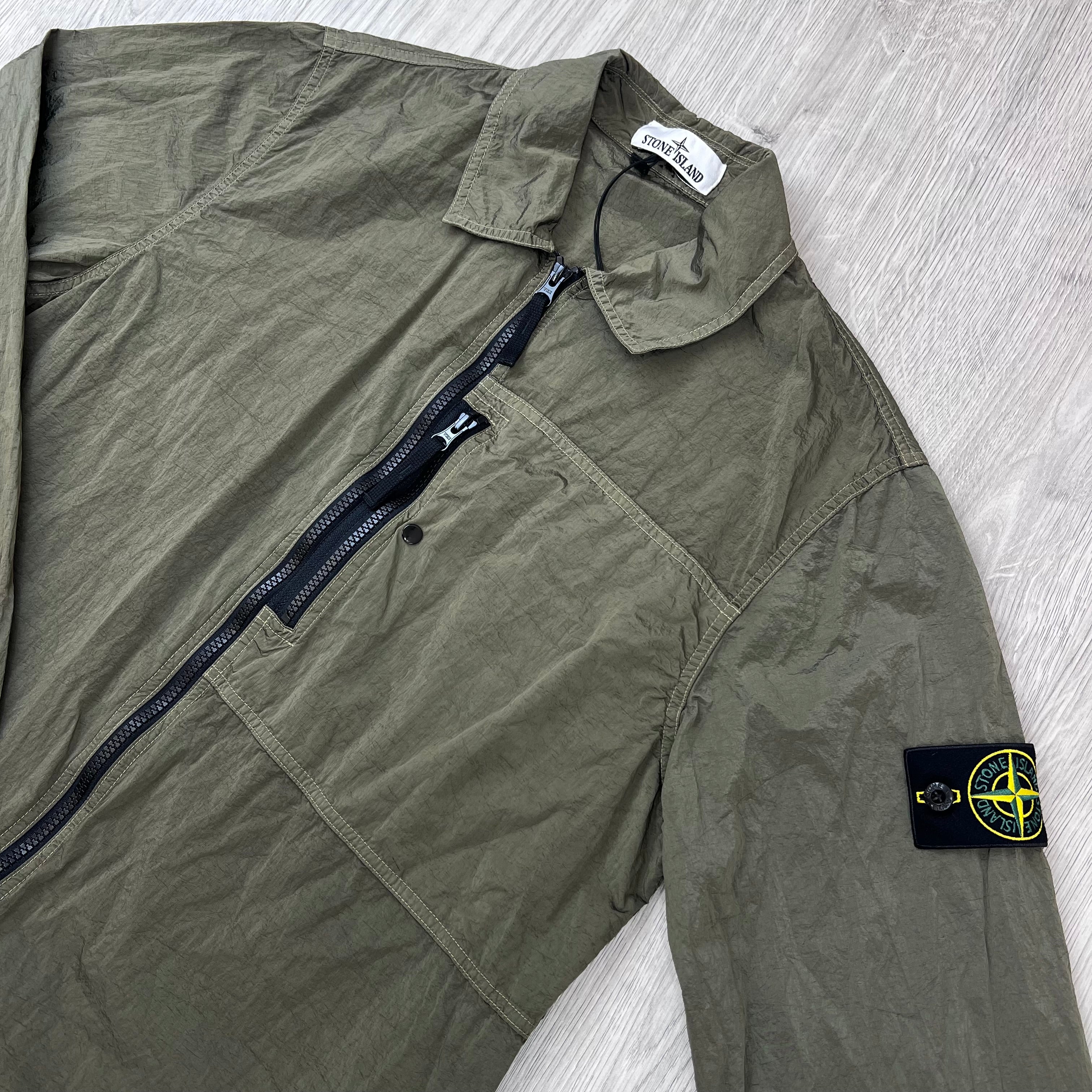Angled view of the Stone Island Nylon Metal Overshirt in Military Green.