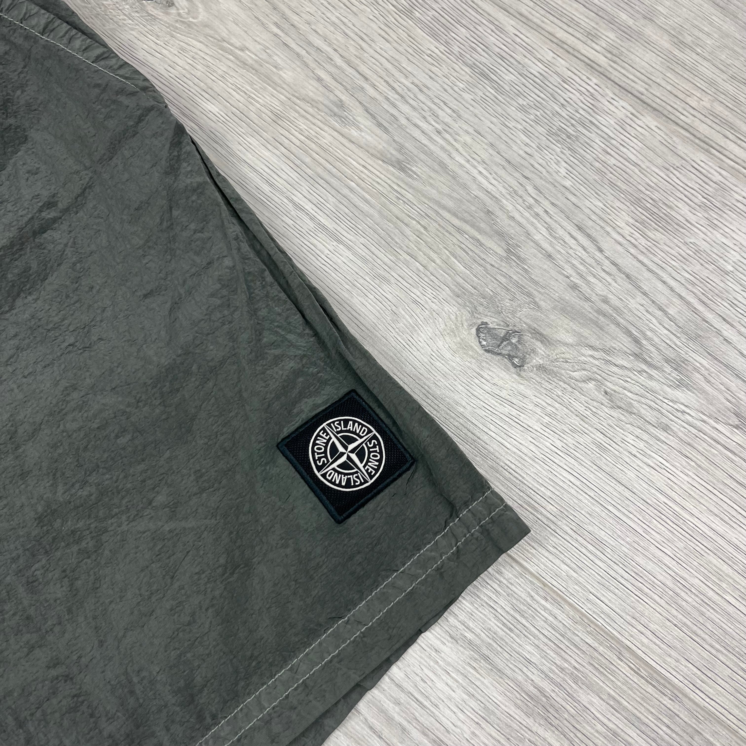 Stone Island Swim Shorts in Military Green. On sale at Open Attire.