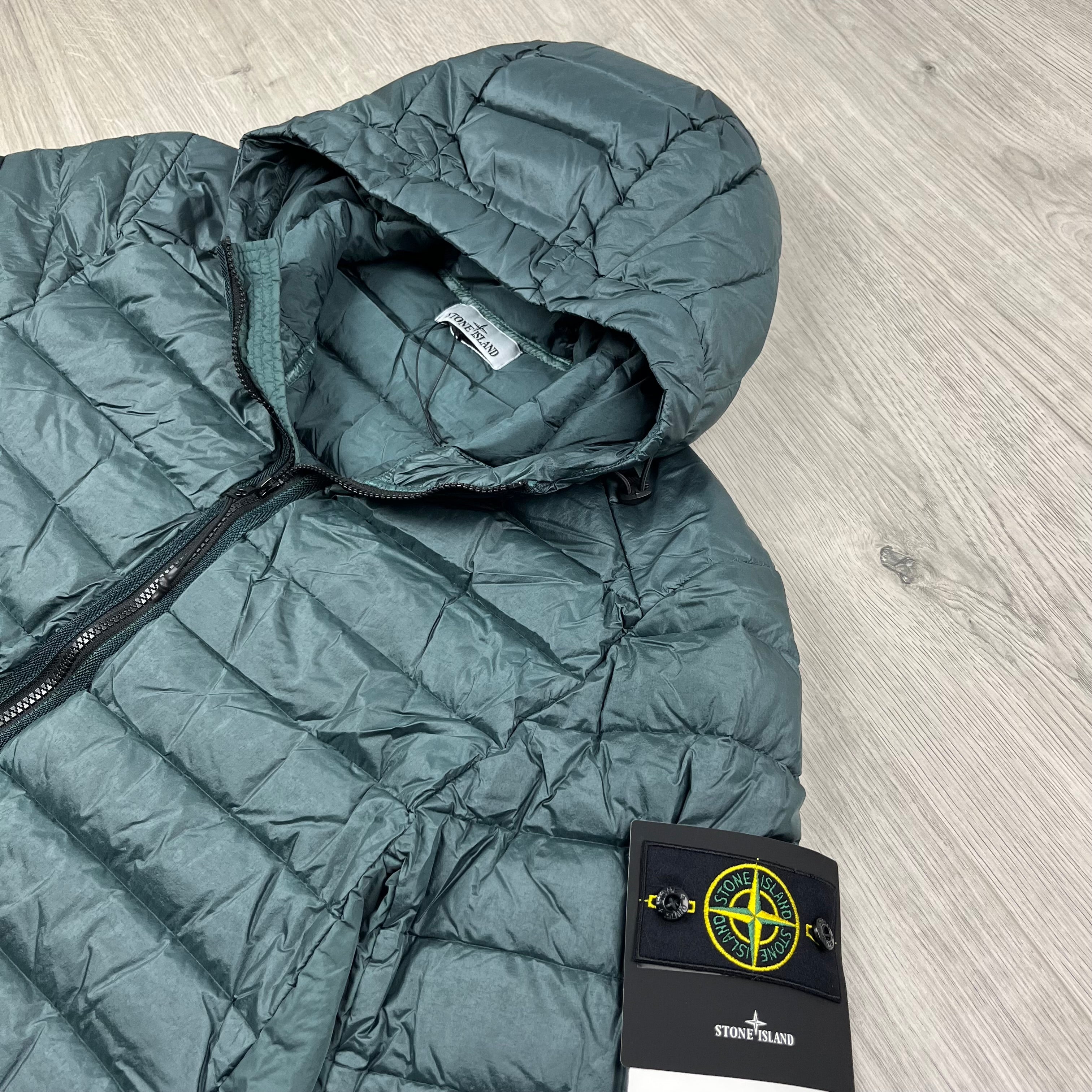 Stone Island Loom Woven Down Jacket in Bottle Green. On sale at Open Attire.