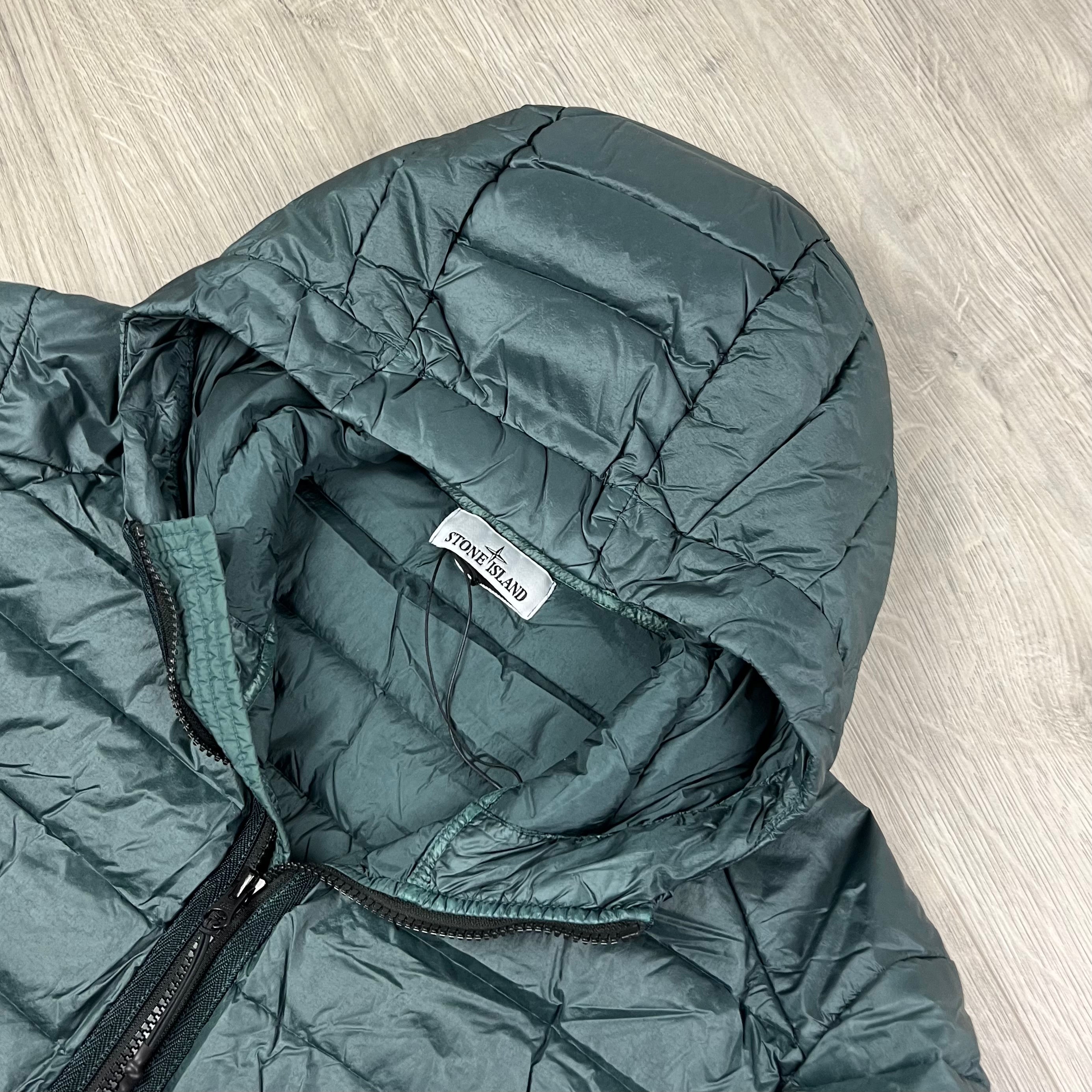 Stone Island Loom Woven Down Jacket in Bottle Green. On sale at Open Attire.