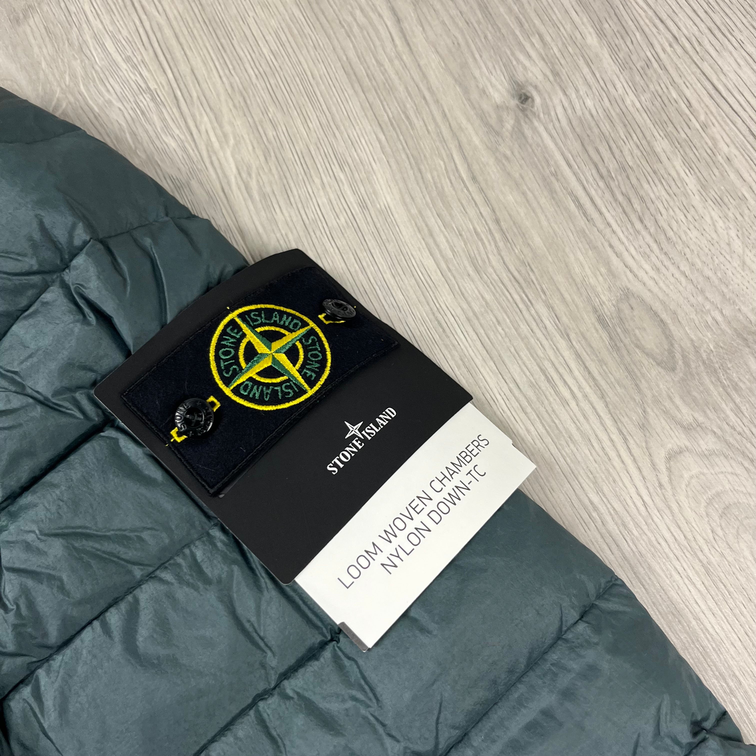 Stone Island Loom Woven Down Jacket in Bottle Green. On sale at Open Attire.